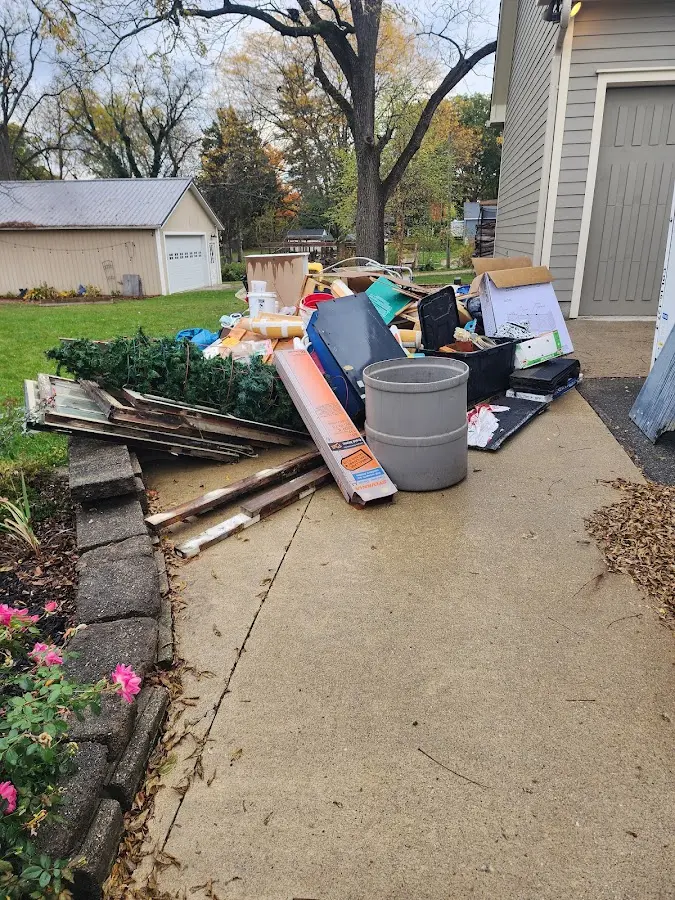 Dumpster being loaded with debris for 3 Yard Dumpster Rental in Wilmington